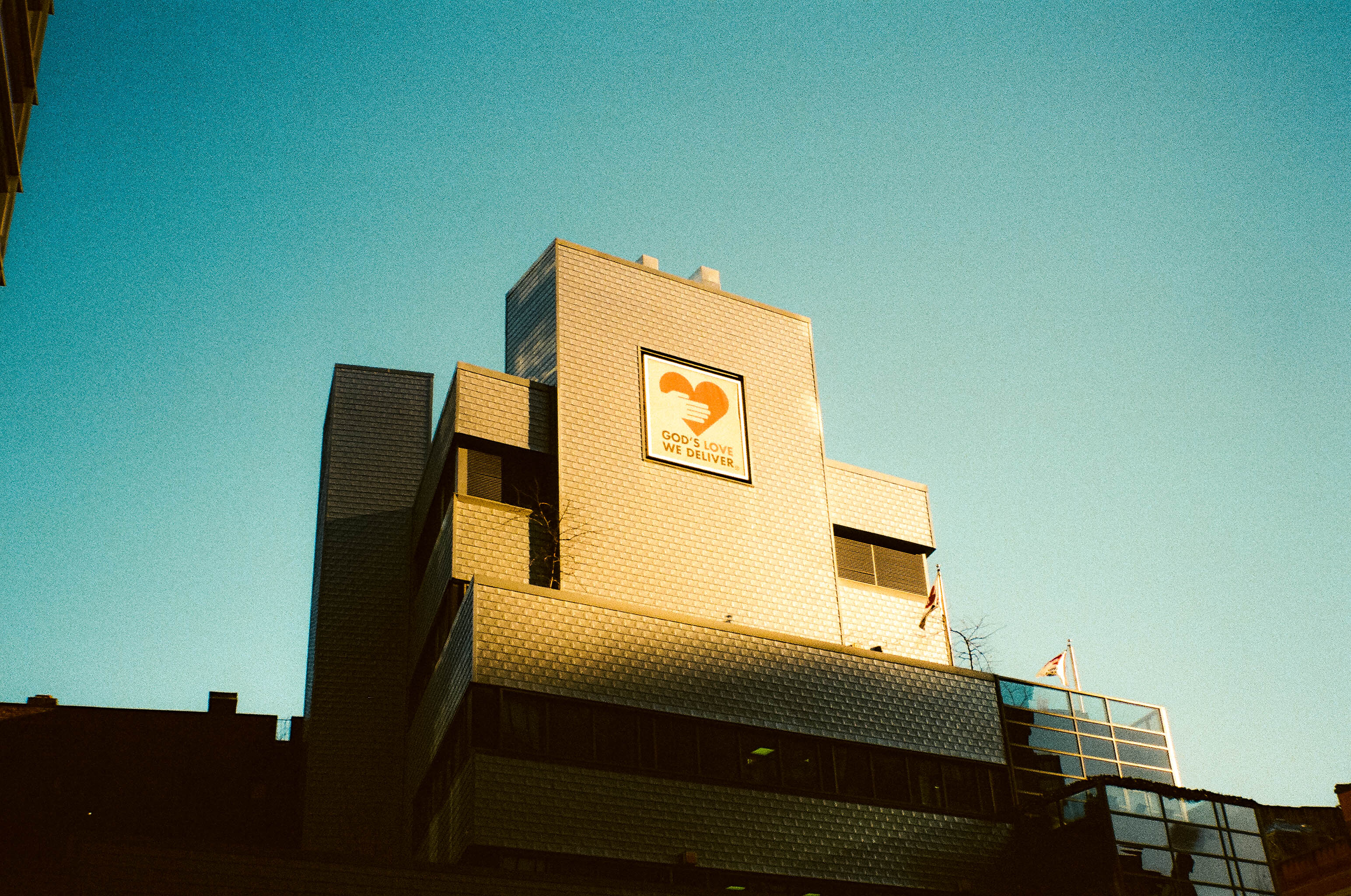 A brick building beneath a blue sky