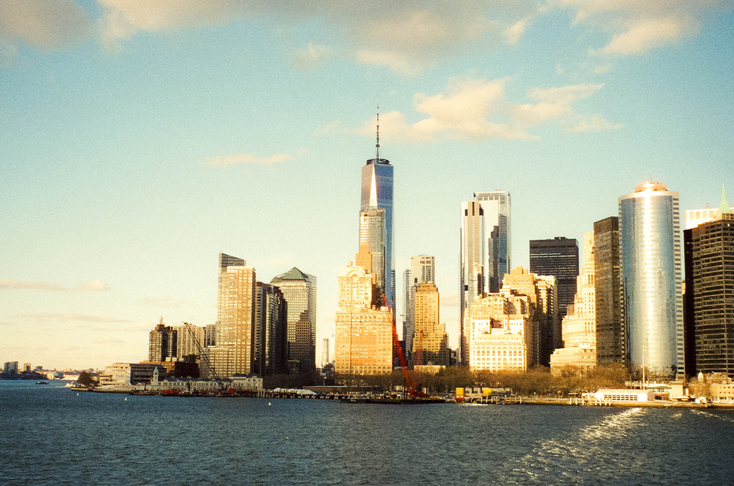 A waterfront skyline in afternoon light